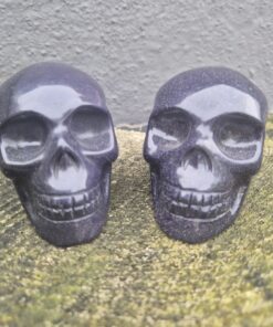 Koppel blauwe goudsteen skulls